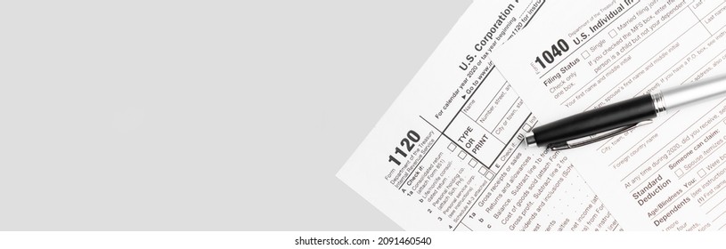 Pen On US TAX Form Background. Tax Day Concept