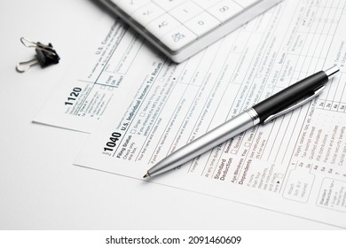 Pen On US TAX Form Background. Tax Day Concept