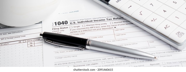 Pen On US TAX Form Background. Tax Day Concept