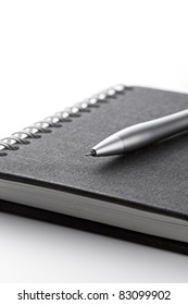pen over note book