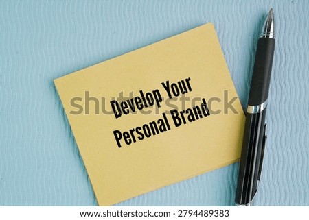 Pen and paper with the words Develop Your Personal Brand. proactively and strategically shaping how the world perceives your professional expertise, skills, and values.
