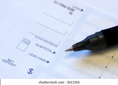 Pen Sitting On Deposit Slip