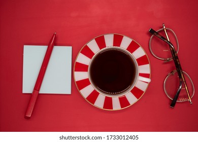 Pen, Stickers, Glasses, A Cup Of Tea With A Saucer On A Laptop Cover, In Red Colors, Making Money On The Internet, Freelancer, Copywriting