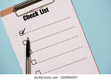 Pen Tick Mark Sign With Check List Paper Sheet And Clipboard On Blue Background For To Do List Or Planing Concept.