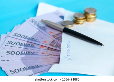 pen white envelope and cash on Desk - Shutterstock ID 1336491893