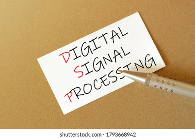 Pen, White Paper With Text DSP Digital Signal Processing On The Brown Background