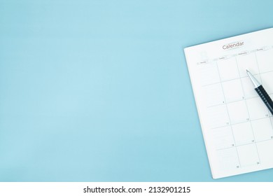 Pen With White Spiral Notepad  Calendar , Business Meeting Agenda Schedule, Travel Planning Booking Or Project Event Milestone And Reminder Yearly Plan Concept.