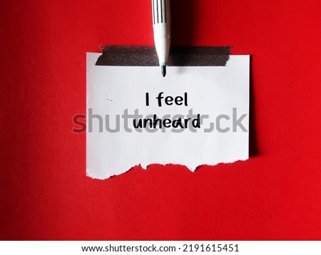 Pen write on a stick note I FEEL UNHEARD, means to feel like nobody listens, feeling unheard by others around, your voice has not taken into account