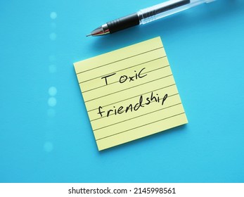 Pen Writing On Note Pad TOXIC FRIENDSHIP, Refers To Friends Who Leave Negative Effects - Mentally Energy Drain And Bring Down Emotionally