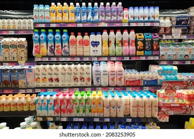 PENANG, MALAYSIA - 10 NOV 2021: Interior view of huge open refrigerator with various brands yogurt drink in Village Grocer store. It is the coolest fresh premium supermarket in Malaysia.