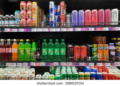 PENANG, MALAYSIA - 10 NOV 2021: Interior view of huge open refrigerator with various brands beverage in Village Grocer store. It is the coolest fresh premium supermarket in Malaysia.