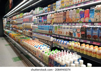 PENANG, MALAYSIA - 10 NOV 2021: Interior view of huge open refrigerator with various brands beverage and food in Village Grocer store. It is the coolest fresh premium supermarket in Malaysia.