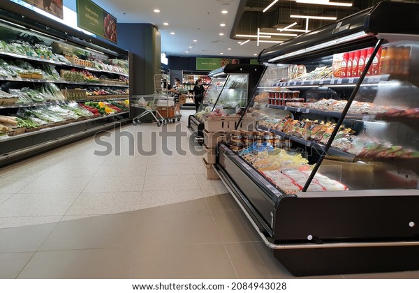 PENANG, MALAYSIA - 10 NOV 2021: Fresh organic\
fruits and vegetables display on refrigerator shelves in Village\
Grocer store. Village Grocer is the coolest fresh premium\
supermarket in\
Malaysia.