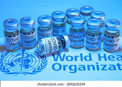 PENANG, MALAYSIA - 13 JAN 2021: Covid-19 Corona Virus 2019-ncov Vaccine Vials Medicine Drug Bottles With World Health Organization (WHO) As Background. Soft Focus Image. Blue Filter Light Effect.