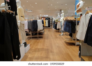 PENANG, MALAYSIA - 18 MAR 2021:  Interior view of Uniqlo store in a shopping mall, Penang. Uniqlo Co., Ltd. is a Japanese casual wear designer, manufacturer and retailer.