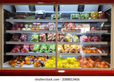 PENANG, MALAYSIA - 2 DEC 2021: Interior view of a huge fridge with various choices fruits in a convenience store in Penang.