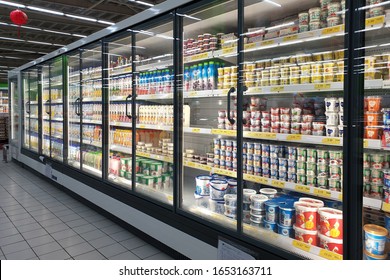 PENANG, MALAYSIA - 20 JAN 2019 : Interior view of full cold shelves with drinks and dairy products and dairy products in a supermarket.