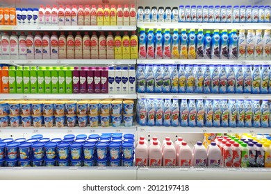 PENANG, MALAYSIA - 21 JULY 2021: View Of The Huge Open Fridge With Various Beverages, Dairy Products And Yogurts In Giant Grocery Store, Penang. Giant Is A Trusted Supermarket Brand In Malaysia.