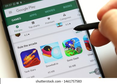 PENANG, MALAYSIA - 26 July 2019: User browsing Google Play Store on Android smartphone. Google Play is an app store for the Android OS, allowing users to download app, games, book, music and movies.
