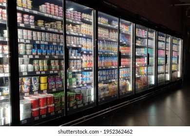 PENANG, MALAYSIA - 5 APR 2021: Interior view of huge glass refrigerator with various brands dairy products in Mercato grocery store. Mercato is the coolest fresh premium supermarket in Malaysia. 