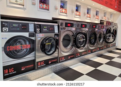 PENANG, MALAYSIA - 5 FEB 2022: Modern Interior view of a 24-hours self service coin laundry and cloth dryers store in Penang.