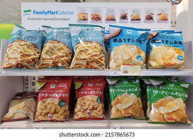 PENANG, MALAYSIA - 7 APR 2022: Various choices chips and snacks in FamilyMart store, Penang. FamilyMart is the third largest Japanese convenience store franchise chain in Japan and operating in Asia.