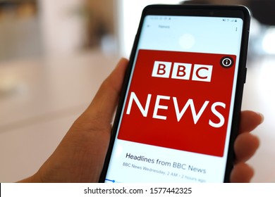 PENANG, MALAYSIA - 9 OCT 2019: User browsing BBC NEWS broadcasting on an Android mobile phone. BBC News is an operational business division of the British Broadcasting Corporation.        