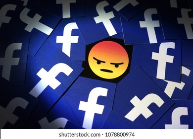 PENANG, MALAYSIA - APRIL 25, 2018: Facebook security and privacy issues. Close up angry face emoji with Facebook logo surrounded it.