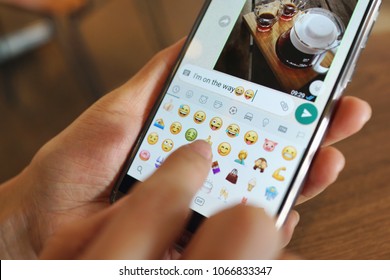 PENANG, MALAYSIA - April 6, 2018: Girl With Smartphone In Her Hands And A Whatsapp Conversation On The Screen. Young Woman, Millennial, Chatting. Technology. Communications.