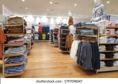 PENANG, MALAYSIA - AUGUST 6, 2020:  Inside of Uniqlo store in Queensbay Mall, Penang. Uniqlo Co., Ltd. is a Japanese casual wear designer, manufacturer and retailer.