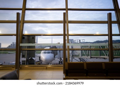 PENANG, MALAYSIA - JUL 13, 2022: Aircraft View From Departure Hall Of Penang International Airport.