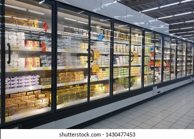 PENANG, MALAYSIA - JUNE 20, 2019: Interior view of huge glass fridge with various brand foods and beverages in Giant grocery store, Penang. Giant is a famous and trusted supermarket brand in Malaysia.