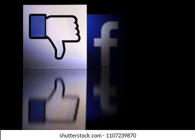 PENANG, MALAYSIA - JUNE 6, 2018: Facebook Security And Privacy Issues. Close Up Dislike Icon With The Facebook Logo Behind It.