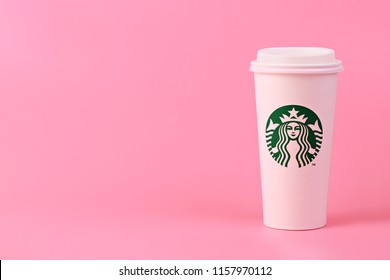 PENANG, MALAYSIA - MAY 1, 2018: White Coffee Cup With Starbucks Logo On Pink Background. Starbucks Is The World's Largest Coffee House With Over 20,000 Stores In 61 Countries.