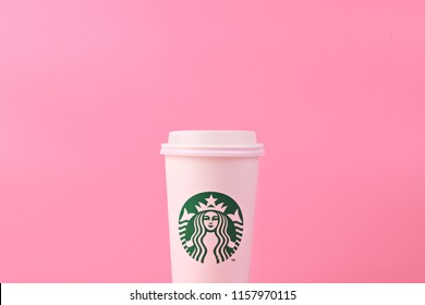 PENANG, MALAYSIA - MAY 1, 2018: White Coffee Cup With Starbucks Logo On Pink Background. Starbucks Is The World's Largest Coffee House With Over 20,000 Stores In 61 Countries.