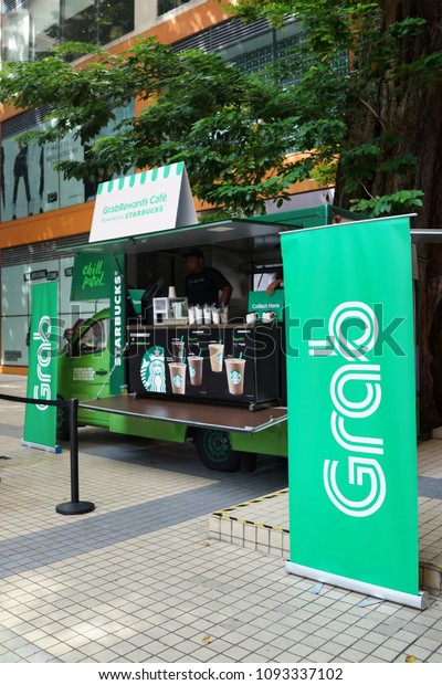 PENANG, MALAYSIA - MAY 5, 2018: GrabRewards\
cafe campaign with Starbucks at Gurney Plaza Penang. Grab is a\
Singapore-based technology company that offers ride-hailing,\
sharing and logistics\
services.