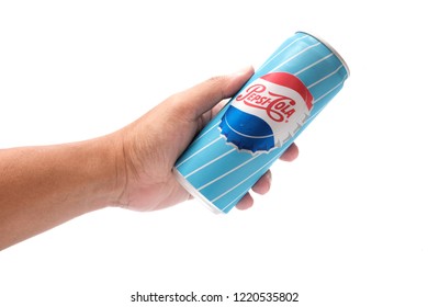 Penang, Malaysia - November 4, 2018 : Close up of a hand holding a Pepsi carbonated soft drink classic can design with white background at Penang 