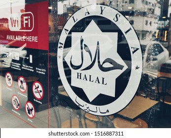 Penang, Malaysia-28th September 2019: Halal sign at the entrance glass door of the KFC restaurant at Bagan area. Halal sign is important for muslim consumer even in Muslim country like Malaysia.