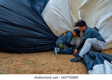 Penang,Malaysia-February 2nd,2020:The Hot Air Balloon Crew Struggling To Wrap Up Their Balloon After The Show.Penang Held This Event Every Year In February.