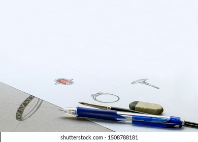 Pencil, brush and eraser isolated on white background. Artist designer drawing sketch jewelry on paper . Design Studio. Creativity Ideas. For add text .Closeup.