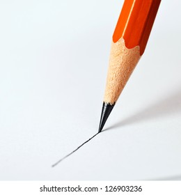 Pencil Draws A Straight Line On A White Background