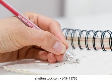 Pencil Eraser Removing A Written Mistake Of Paper, Delete, Correct, And Mistake Concept.