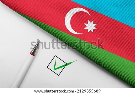 Pencil, Flag of Azerbaijan and check mark on paper sheet 