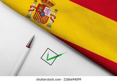 Pencil, Flag of Spain and check mark on paper sheet  - Shutterstock ID 2186694099