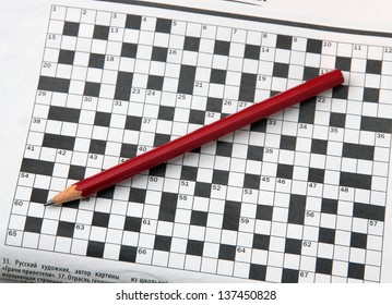 Pencil And Newspaper With A Crossword.