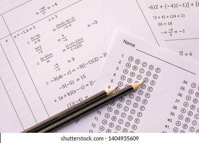 Pencil On Answer Sheets Or Standardized Test Form With Answers Bubbled. Multiple Choice Answer Sheet 
