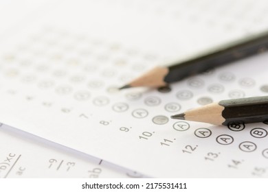 Pencil On Answer Sheets Or Standardized Test Form With Answers Bubbled. Multiple Choice Answer Sheet