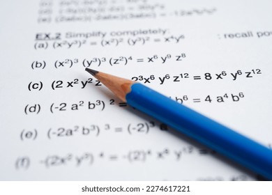 Pencil on mathematic formula exercise test paper in education school.