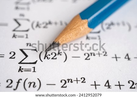 Pencil on mathematic formula exercise test paper in education school.