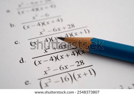 Pencil on mathematic formula exercise test paper in education school.